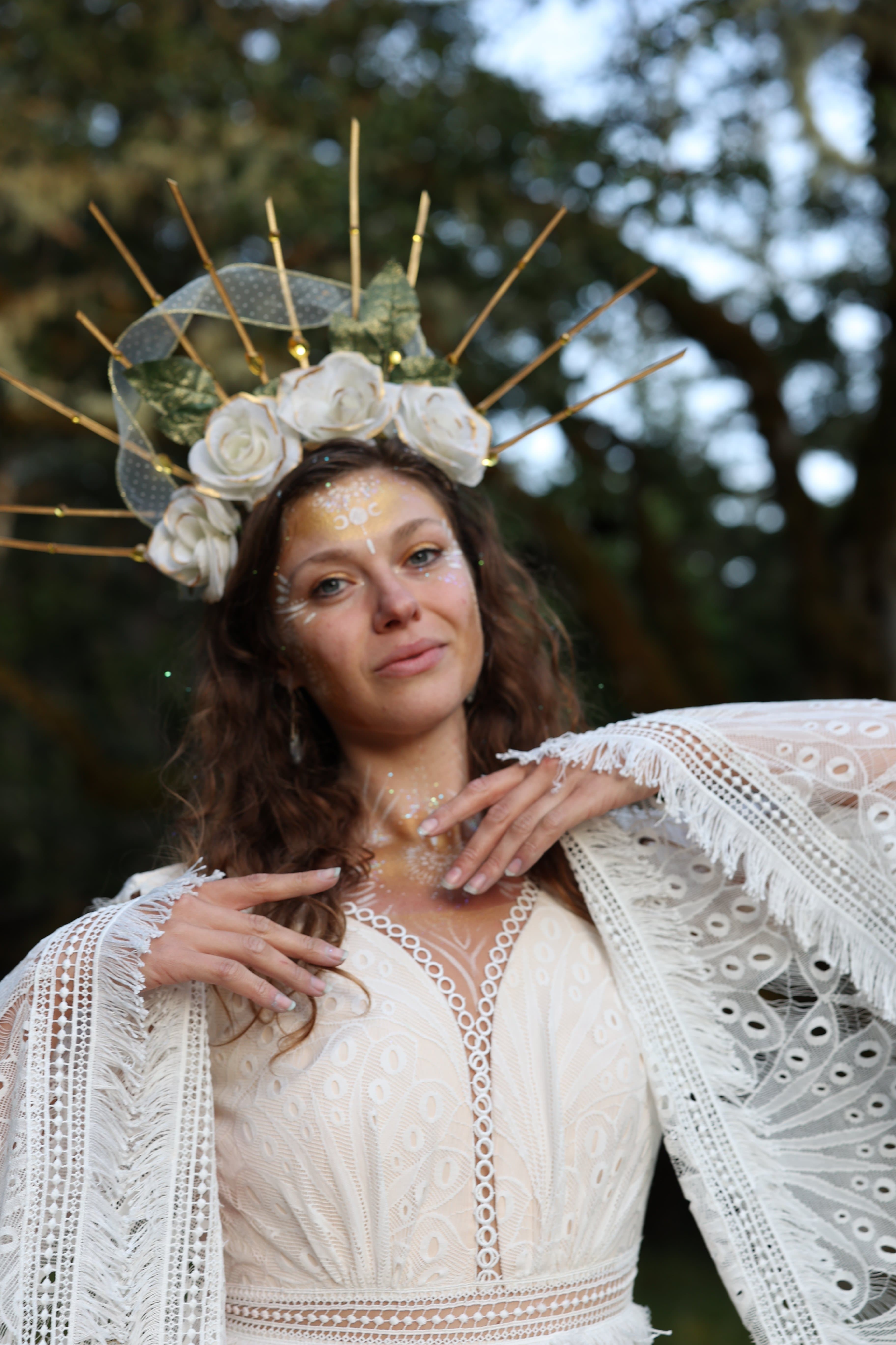 Margo Free wearing a white rose crown and white lace in a forest